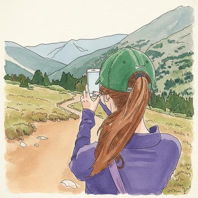 Illustration of a walker photographing a mountain path with their phone